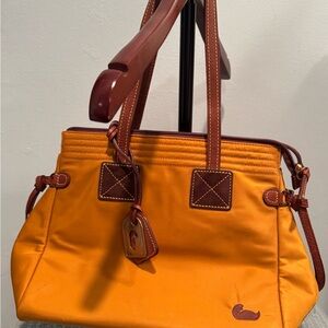 NWOT. Dooney & Bourke mustard yellow ‘Victoria’ Bag with Leather Accents.